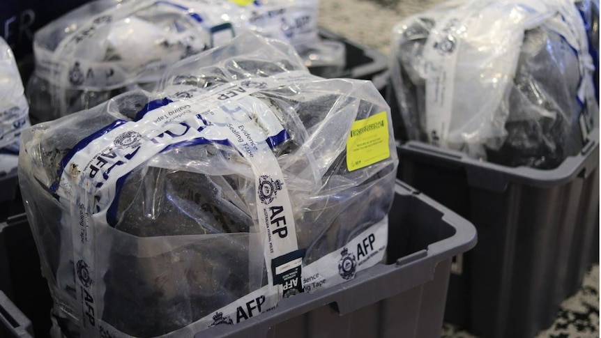 Packages of seized cocaine wrapped up and displayed at an AFP press conference.