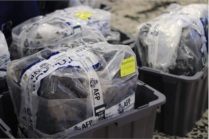 Packages of seized cocaine wrapped up and displayed at an AFP press conference.