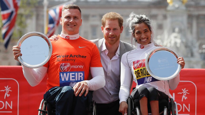 Madison Rozario and David Weir pose with Prince Harry after winning London Marathon