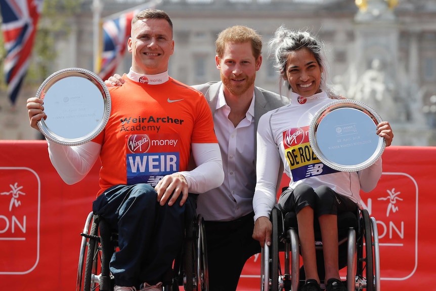 Madison Rozario and David Weir pose with Prince Harry after winning London Marathon
