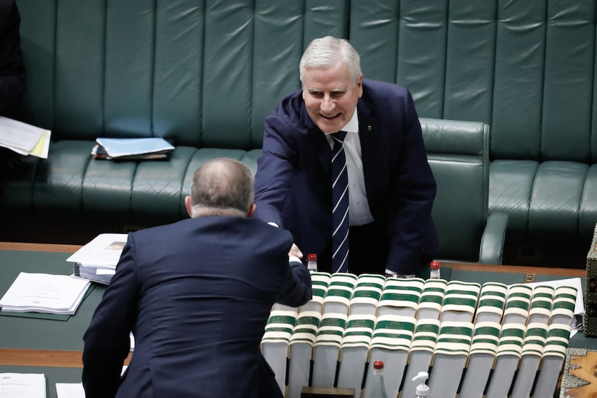 Michael McCormack shakes hands with Anthony Albanese.