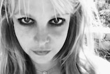 A black and white headshot image of Britney Spears