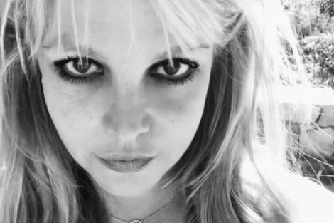 A black and white headshot image of Britney Spears