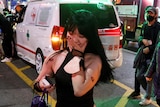 Women in tears wearing Halloween costumes after stampede kills more than 150 people in South Korea
