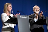 Iran's foreign minister claps after nuclear talk statements