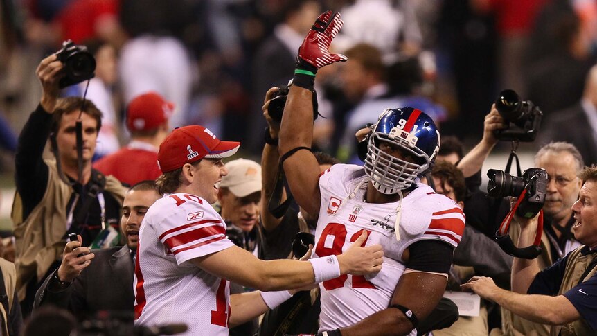 New York Giants player Eli Manning celebrates after winning the Super Bowl