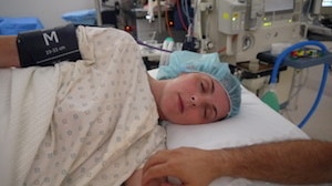 A mother using hypnobirthing techniques during her caesarian birth