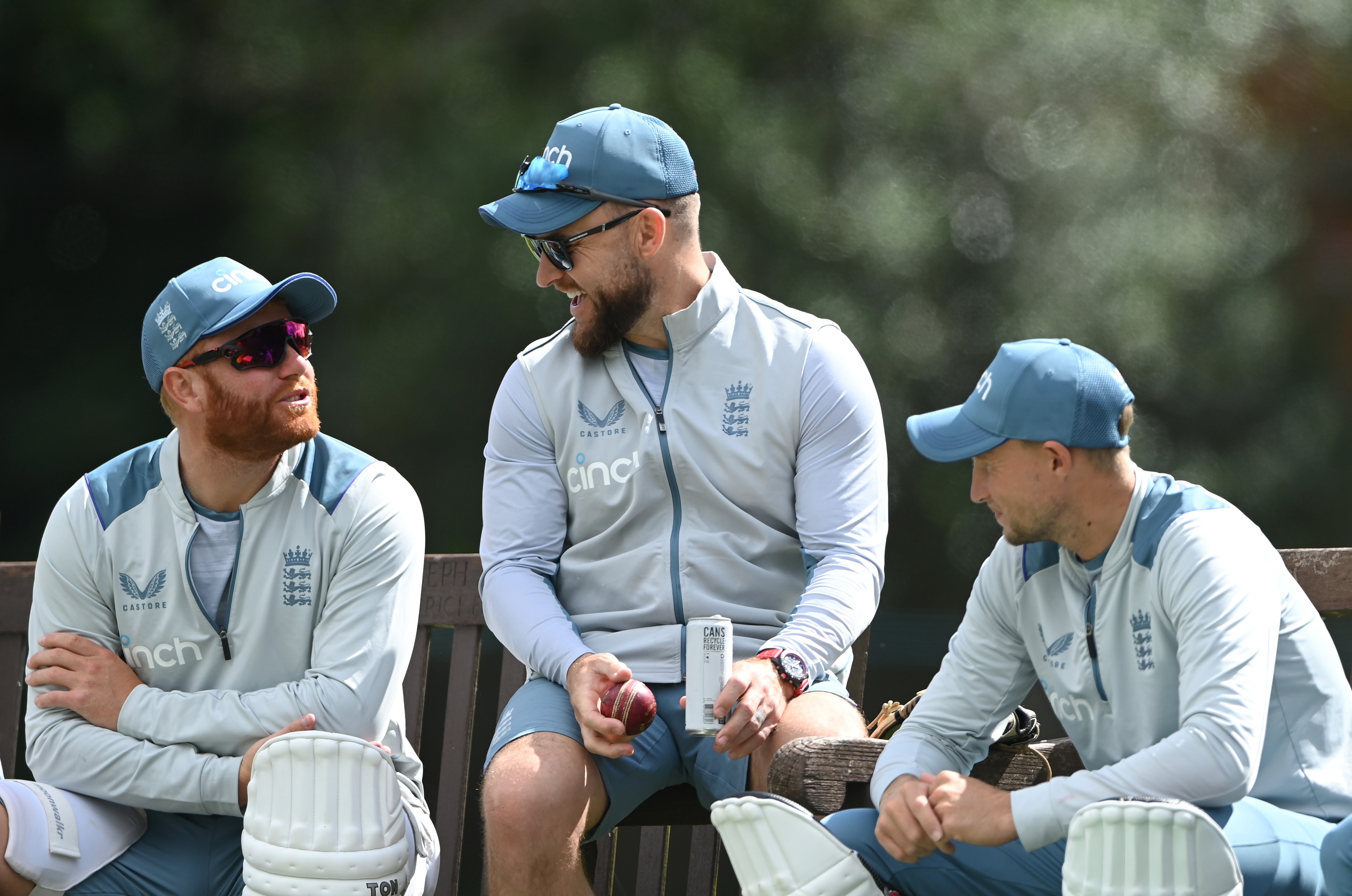 Brendon McCullum laughs with Jonny Baistow and Joe Root.