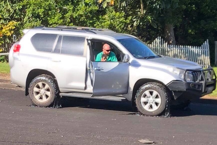 Four wheel drive with melting bitumen on wheels.