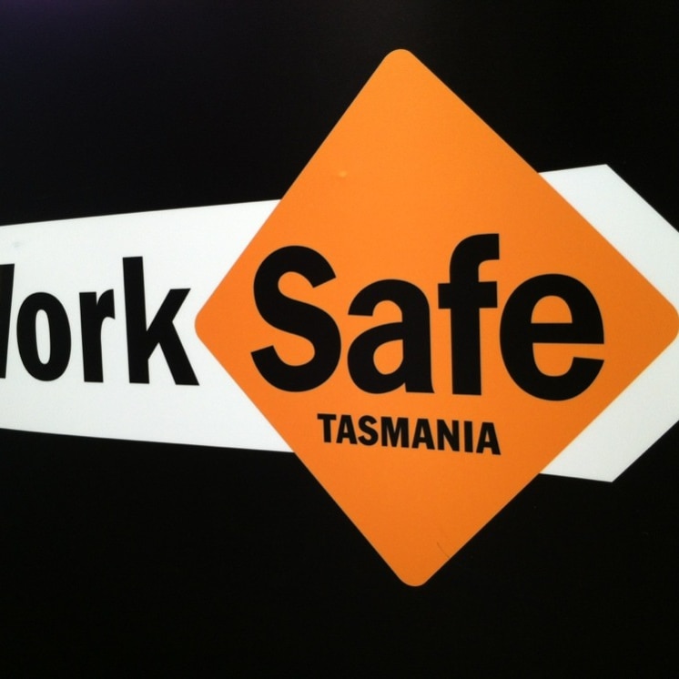 A black, white and orange logo that says WorkSafe Tasmania.