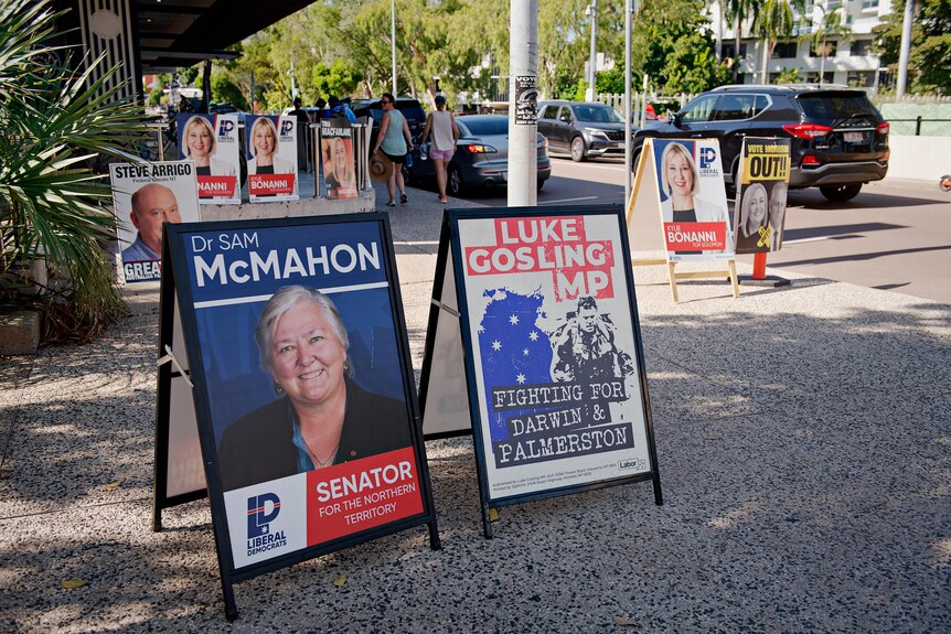 A field of election banners are pitched on a city street