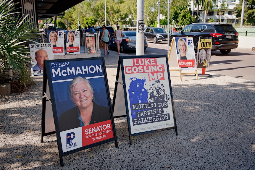 A field of election banners are pitched on a city street