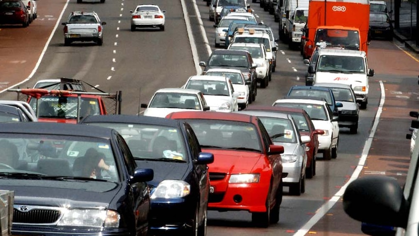 A line of cars on the road.