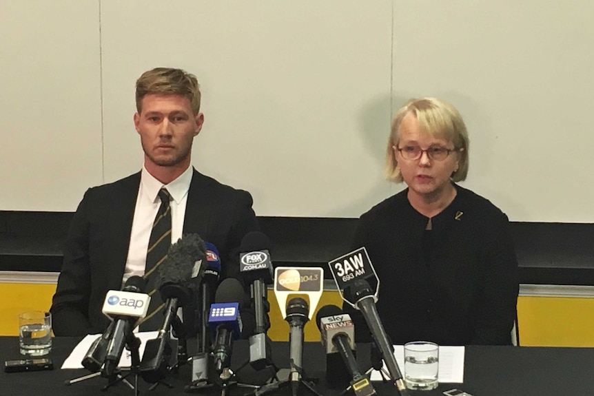 Nathan Broad and Peggy O'Neal talk to media at a press conference.