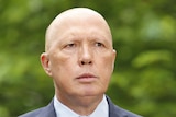 Peter Dutton speaks in a courtyard at Parliament House