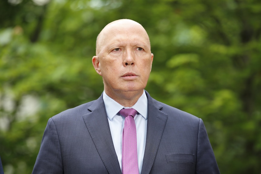 Peter Dutton speaks in a courtyard at Parliament House