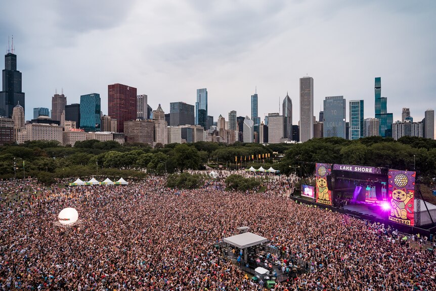 An aerial photo of a large crowd in front of a stage at the 2021 Lollapalooza music festival in Chicago 
