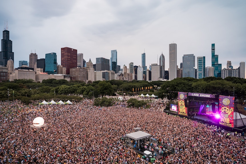 An aerial photo of a large crowd in front of a stage at the 2021 Lollapalooza music festival in Chicago 