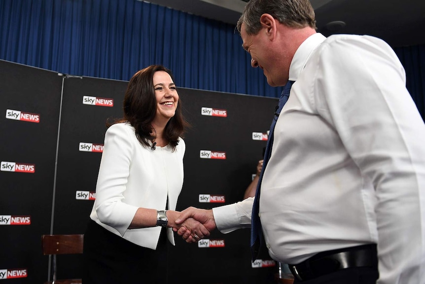 Annastacia Palaszczuk and Tim Nicholls shake hands