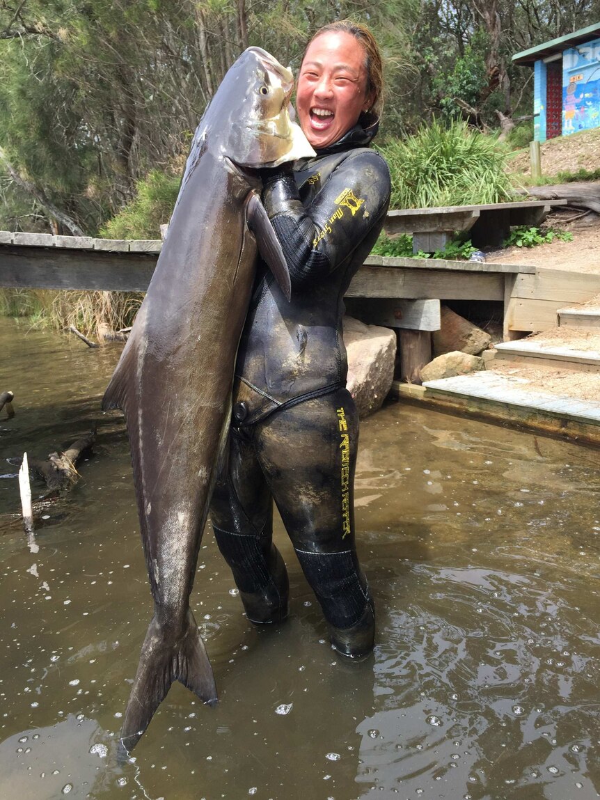 Kate Rogers with a large cobia she caught on a spearfishing dive near Ulladulla