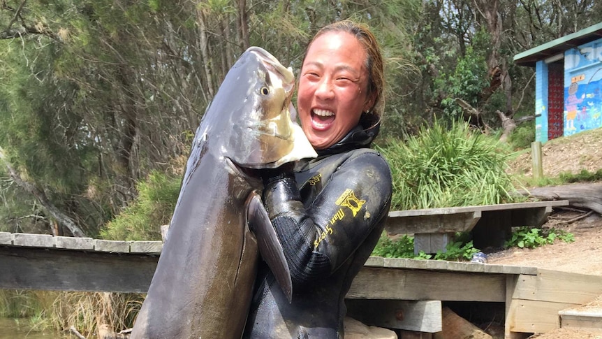 Kate Rogers with a large cobia she caught on a spearfishing dive near Ulladulla