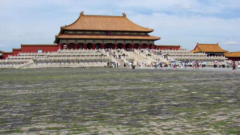 Tourists gather inside the Forbidden City located in Beijing's Tiananmen Square