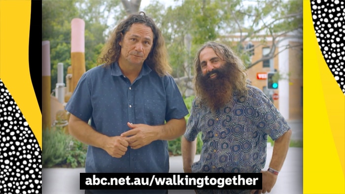Two men smiling at camera with text abc.net.au/walkingtogether