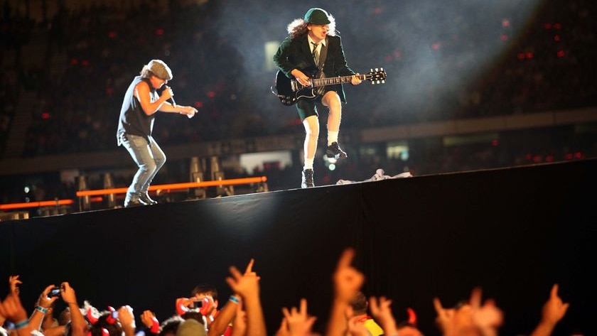 LtoR AC/DC's Brian Johnson and Angus Young rock the crowd