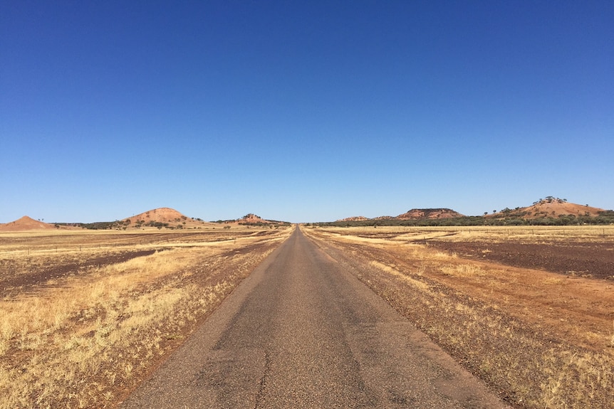 A long stretch of straight road in outback Queensland.
