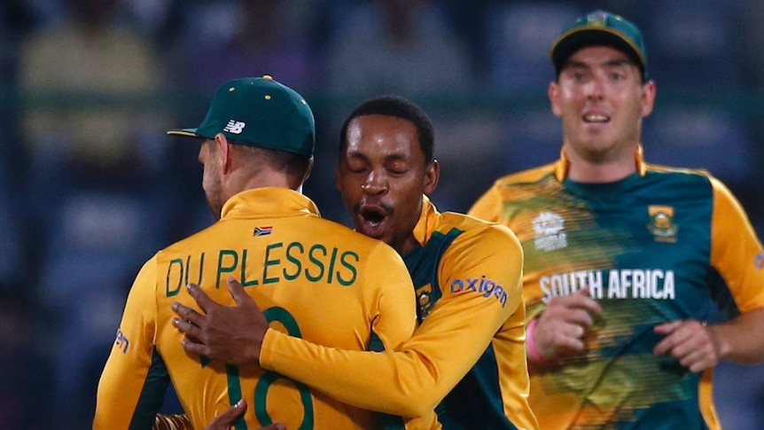 South Africa's Aaron Phangiso (C) celebrates with Faf du Plessis after a wicket against Sri Lanka.