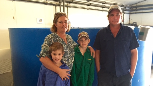 The Besch family in front of one of their barramundi tanks