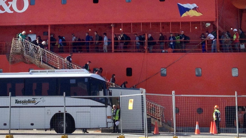 People disembark from the Aurora Australis in Hobart.