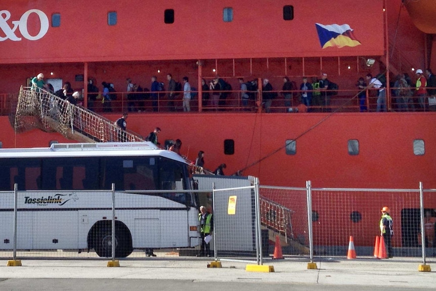 People disembark from the Aurora Australis in Hobart.