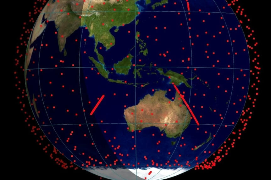 Une image 3D de la terre avec des centaines de points rouges représentant des satellites.