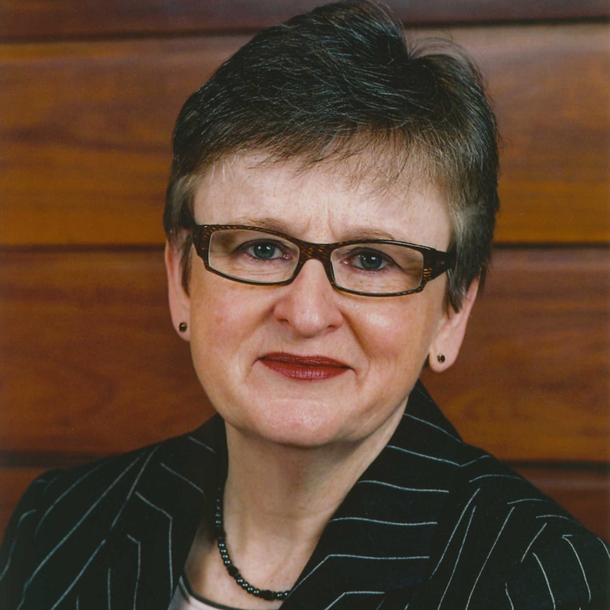 Official portrait of Justice Virginia Bell in wood pannelling.