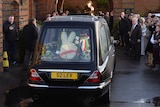The funeral cortege of Ronnie Biggs arrives at Golders Green Crematorium in north London