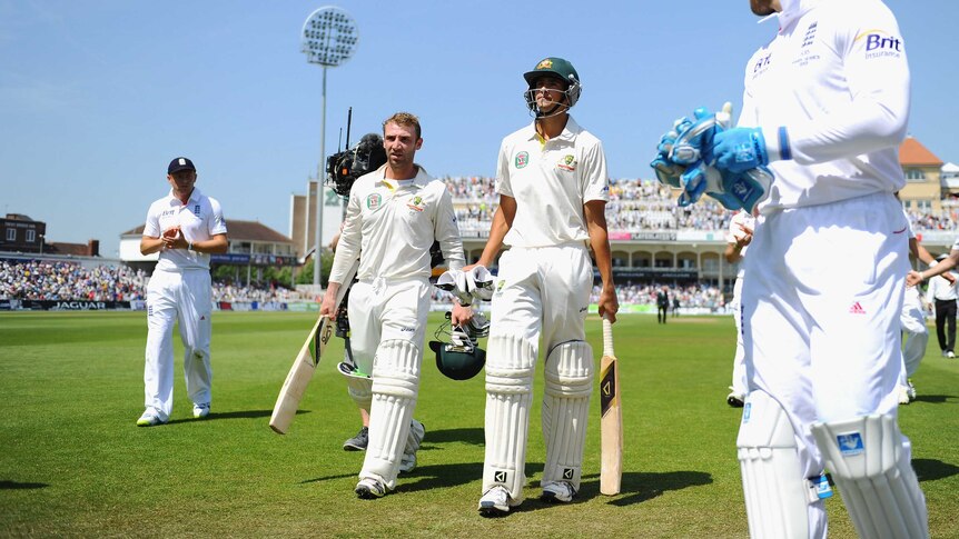 Ashton Agar and Phil Hughes walk off Trent Bridge at lunch on day two