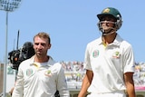 Ashton Agar and Phil Hughes walk off Trent Bridge at lunch on day two