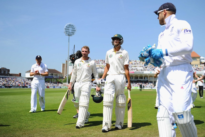 Ashton Agar and Phil Hughes walk off Trent Bridge at lunch on day two