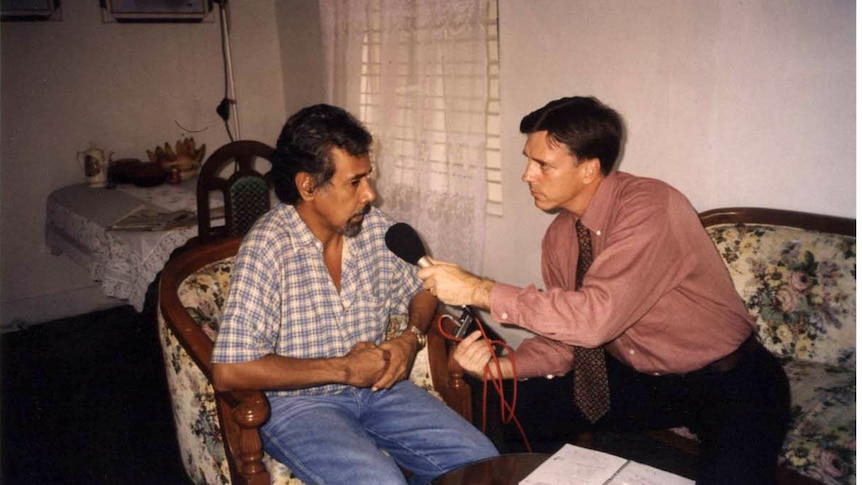 An archive image of a man interviewing another man
