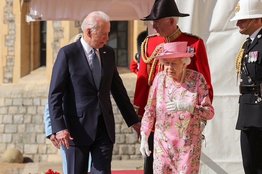 Queen Elizabeth walks with US President Joe Biden and first lady Jill Biden