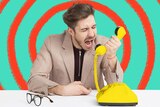 Man frustratingly yelling into yellow phone for a story about how to turn frustration into kindness