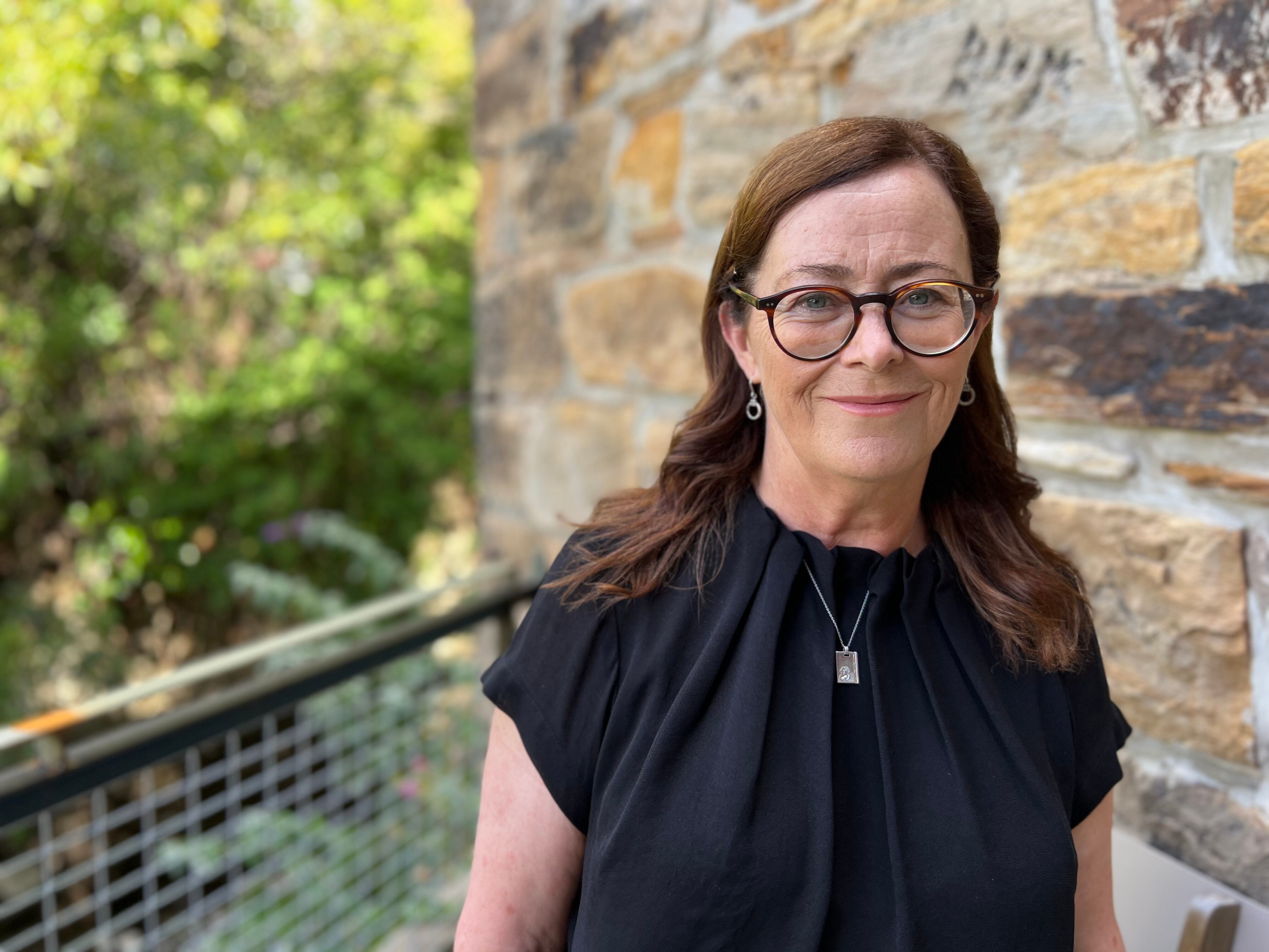 Kate Crowley smiles at the camera.