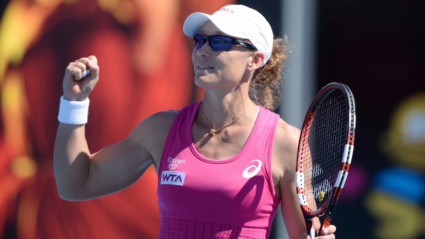 Sam Stosur celebrates winning her match against Kristina Mladenovic at 2014 Hobart International.