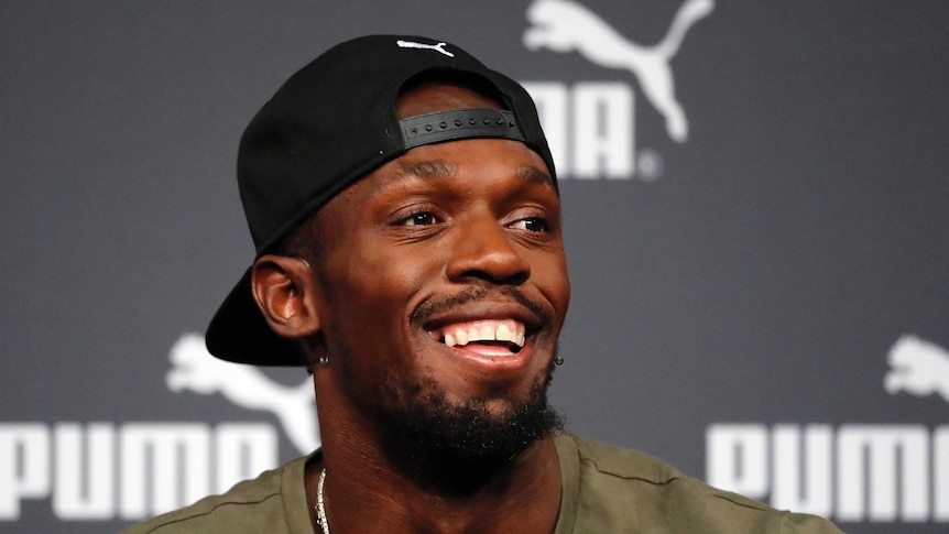 Jamaican athlete Usain Bolt addresses the media during a press conference.