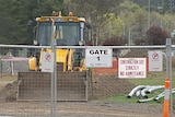 Upgrade work on the sporting field has been suspended and the area remains fenced off.