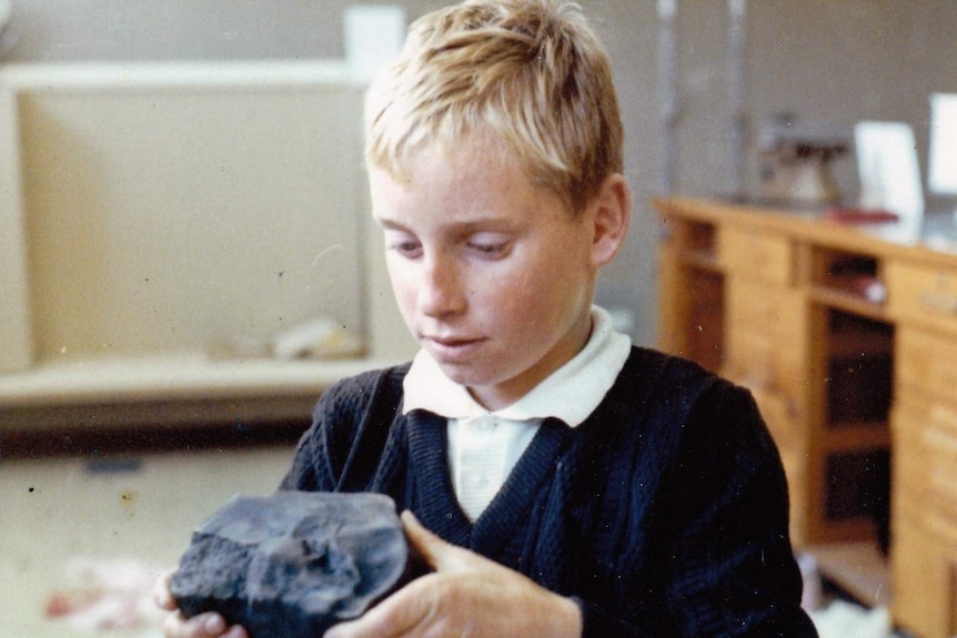 A young Peter Gillick holding a piece of the meteorite in his home in Murchison.