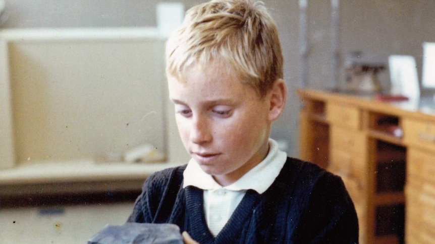 A young Peter Gillick holding a piece of the meteorite in his home in Murchison.