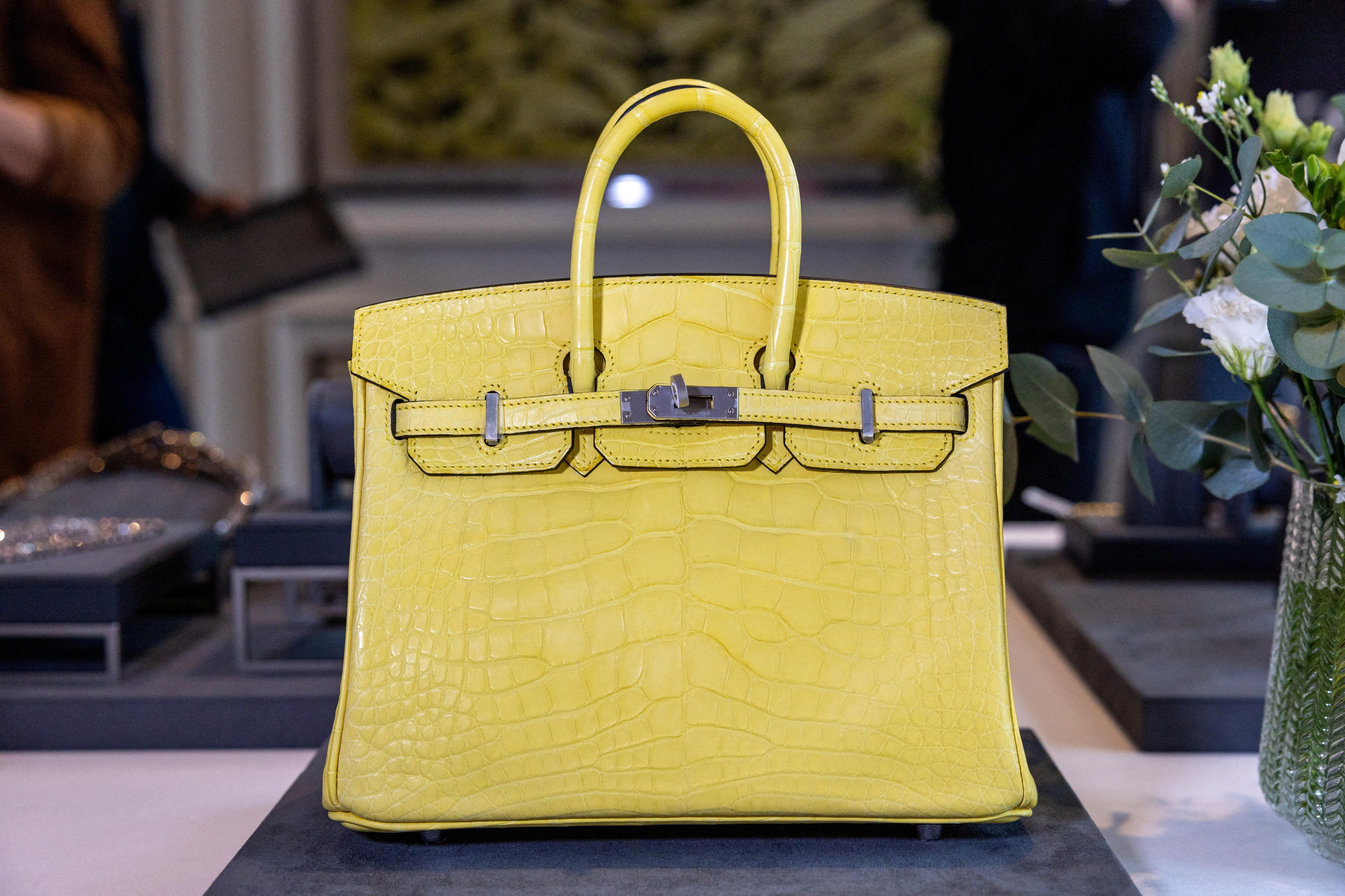 A Mimosa Matte Mississippiensis Alligator Birkin handbag during an auction preview at Sotheby's in Geneva, Switzerland. 