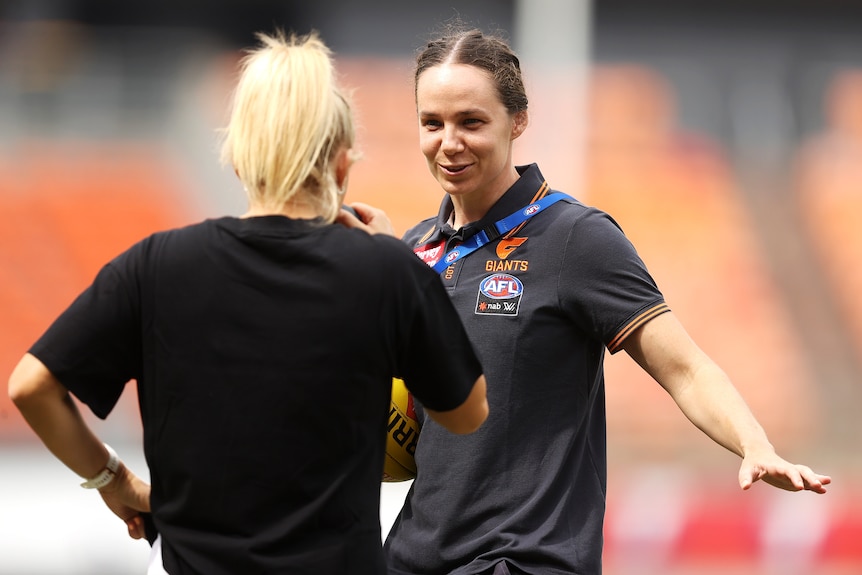 Sarah Hosking of the Tigers and Chloe Dalton of the Giants speak on field